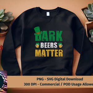 May include: Black sweatshirt with a green shamrock design and the text "Dark Beers Matter".