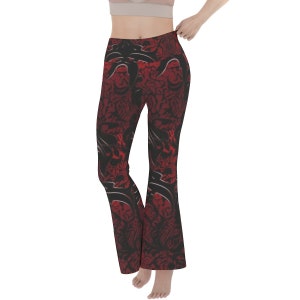 May include: Red and black patterned yoga pants with a wide leg.