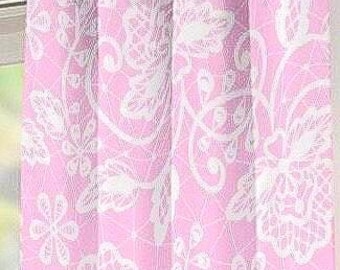 May include: Pink and white floral patterned curtain panels. The curtains are made of a soft fabric and feature a delicate white lace-like design. The panels are hanging on a silver rod, with grommets at the top for easy installation.