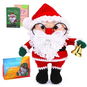 May include: A handmade crochet Santa Claus doll with a red hat, coat, and black boots. The doll has a white beard, glasses, and a gold bell. The image also includes a "Beginner Crochet Set" and a booklet titled "Santa Claus Instructions".