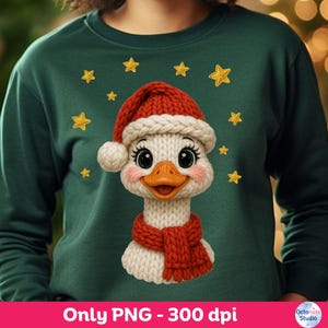 May include: A dark green sweatshirt featuring a knitted duck wearing a Santa hat and scarf. The duck has rosy cheeks and large eyes. Gold stars are scattered around the duck. The text "Only PNG - 300 dpi" is at the bottom.