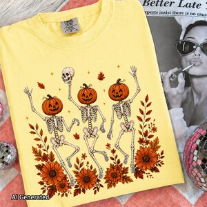 Butter yellow crewneck T-shirt flat lay displaying the Wildflower Skeleton design with vibrant floral fall accents.