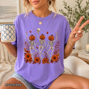 Lavender purple oversized crewneck T-shirt featuring the Wildflower Skeleton artwork with a playful girly Halloween look.