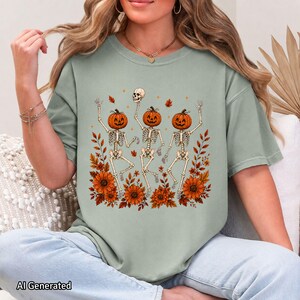 Sage green oversized crewneck T-shirt styled with the Wildflower Skeleton artwork and floral skeleton details.