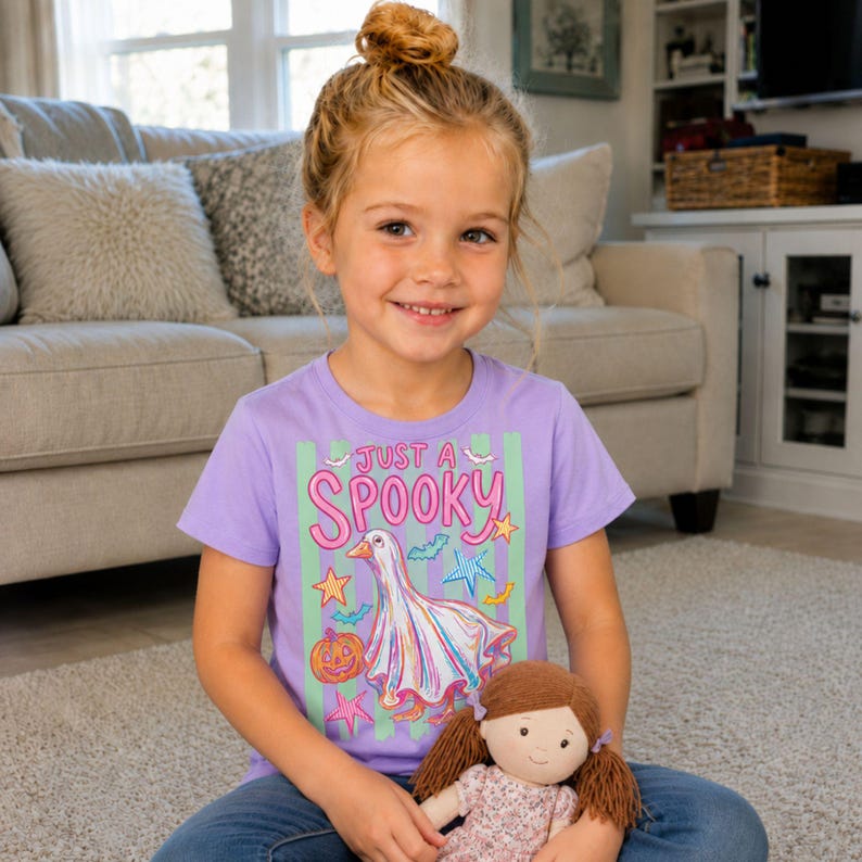 Halloween Goose shown on a kids lavender short sleeve t-shirt.
A playful ghost goose design with stripes for cute Halloween family outfits.