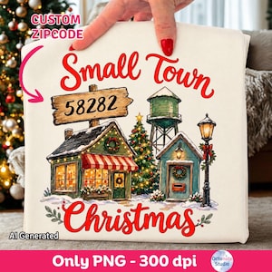 May include: A white fabric item featuring a graphic of a small town with a wooden sign reading 58282, a water tower, a decorated Christmas tree, a shop with a red striped awning, and a street lamp, with the text Small Town Christmas.
