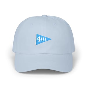 May include: Light blue baseball cap with a curved brim. The cap features a white and blue pennant logo with the number "401" embroidered on the front. The hat is made of a soft material and has a classic, casual style.