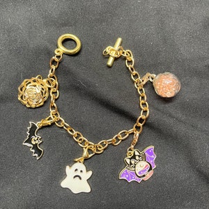 Charm bracelet with five mystery charms