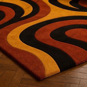 Add a touch of retro charm to your space with our Retro 70s Geometric Wave Rug – a Mid Century Modern tufted shag carpet featuring bold wavy patterns and rich vintage hues. Perfect as a groovy boho accent rug for your living room, bedroom, or lounge, this handmade floor decor blends nostalgic 70s style with cozy modern comfort.
