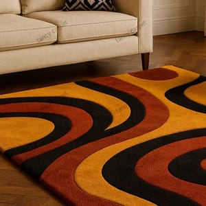Add a touch of retro charm to your space with our Retro 70s Geometric Wave Rug – a Mid Century Modern tufted shag carpet featuring bold wavy patterns and rich vintage hues. Perfect as a groovy boho accent rug for your living room, bedroom, or lounge, this handmade floor decor blends nostalgic 70s style with cozy modern comfort.