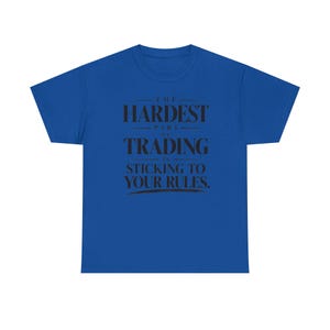 May include: A royal blue short-sleeve t-shirt featuring black text centered on the chest that reads: THE HARDEST PART OF TRADING IS STICKING TO YOUR RULES. The shirt has a crew neckline and a standard fit, displaying a clear, bold graphic design.