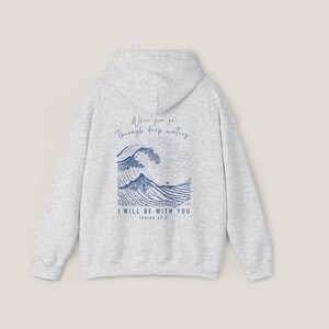 Back of Sand hoodie. Front says, Isaiah 43 2. Back of hoodie is Isaiah 43 2 scripture with illustration of waves in blue