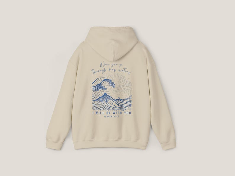 Back of Sand hoodie. Front says, Isaiah 43 2. Back of hoodie is Isaiah 43 2 scripture with illustration of waves in blue