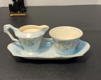 Juego de azucarero y cremera con diseño floral en azul jaspeado de James Kent Ltd, década de 1920