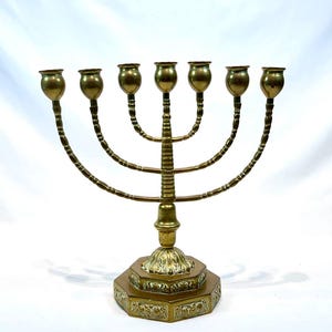 Antique Swedish brass menorah with seven candles and two-tiered octagonal base. Early 1900&#39;s. Heavy decorative piece.