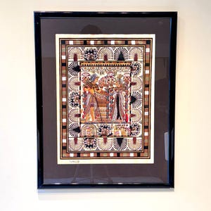 Papyrus painting of the King Tut&#39;s Marriage card with golden highlights.