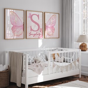 Pink butterfly-themed wall art set for girls' bedrooms or nurseries.
