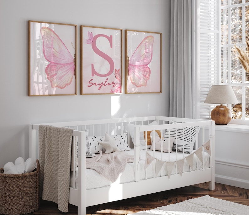 Pink butterfly-themed wall art set for girls' bedrooms or nurseries.