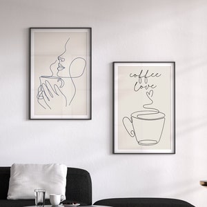 May include: Two framed illustrations with a minimalist line art style. The first illustration shows a person drinking from a cup with steam rising from the cup. The second illustration shows a cup of coffee with steam rising from the cup and the text "coffee love" written above the cup.