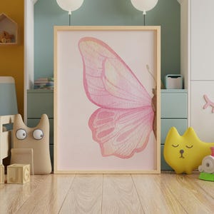 Girls' nursery wall decor with minimalist butterfly design.