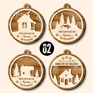 May include: Four wooden Christmas ornaments with a circular design. Each ornament features a house or cabin scene with trees and snowflakes. The text "THERE IS NO PLACE LIKE HOME FOR THE HOLIDAYS" is included on each ornament.