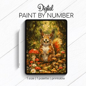 May include: A digital paint by number kit featuring a brown squirrel standing among red and white mushrooms and small flowers. The artwork is displayed on a tablet screen with a stylus pen positioned to the left. Text reads Digital PAINT BY NUMBER.