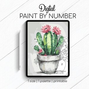 May include: Digital paint by number image of a cactus with pink flowers in a white pot. The image is displayed on a tablet screen.