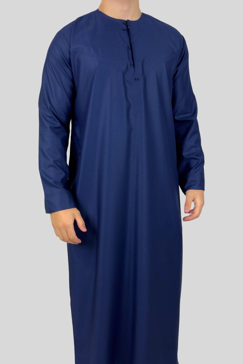 Navy Omani thobe: A classic garment embodying timeless elegance with its rich navy hue, traditional design, and cultural significance.