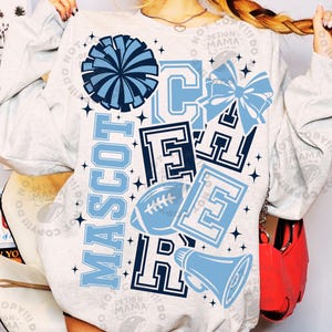 May include: A light gray crewneck sweatshirt featuring a large graphic print in shades of light blue and navy. The design includes the word MASCOT vertically, the word CHEER vertically, a pom-pom, a football, a megaphone, and a hair bow.