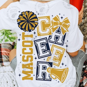 May include: White t-shirt with a cheerleading design. The design includes a pom-pom, bow, megaphone, and the word "MASCOT" vertically. The word "CHEER" is displayed in a collegiate font. The colors are navy blue and gold.