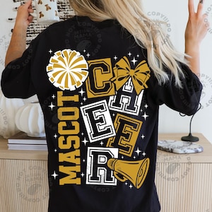 May include: Black t-shirt with a gold and white design. The design includes the words "MASCOT CHEER" in a collegiate font, a pom-pom, a bow, and a megaphone. The shirt is a casual style.