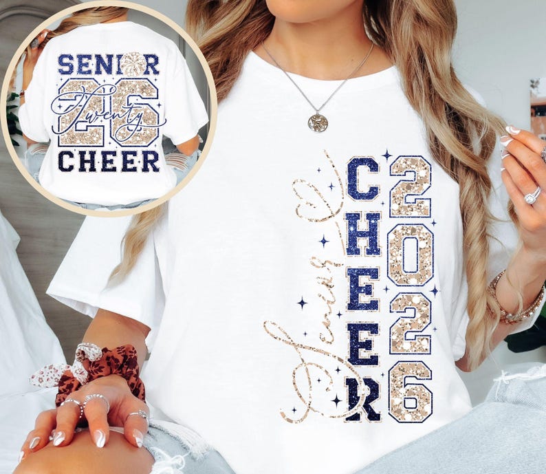 May include: White t-shirt with the words "Senior Twenty 26 Cheer" printed on the back and "Love Cheer 2026" on the front. The design features navy blue and gold glitter accents, perfect for cheerleading.