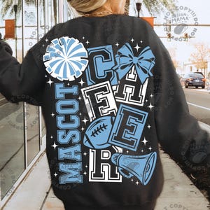 May include: A black long-sleeve sweatshirt featuring a large graphic on the back with the word CHEER in block letters, a football, a megaphone, a pom-pom, and a bow. The design is in light blue and white with small star accents throughout.