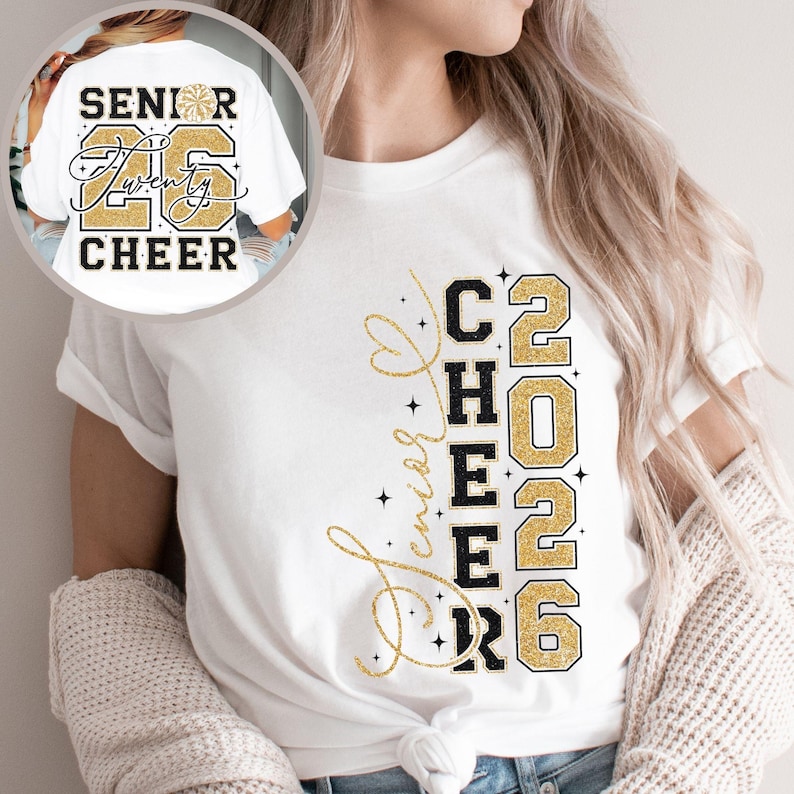 May include: White t-shirt with the text "Senior Twenty Cheer 2026" in black and gold glitter lettering. The design includes a cheerleader pom-pom graphic. The shirt is a casual style.