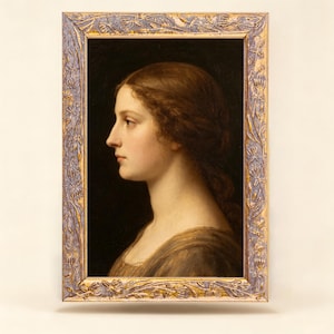May include: A framed oil painting depicting a profile portrait of a person with long brown hair against a dark background. The rectangular frame features a textured, weathered finish in shades of muted purple and gold with floral carvings.