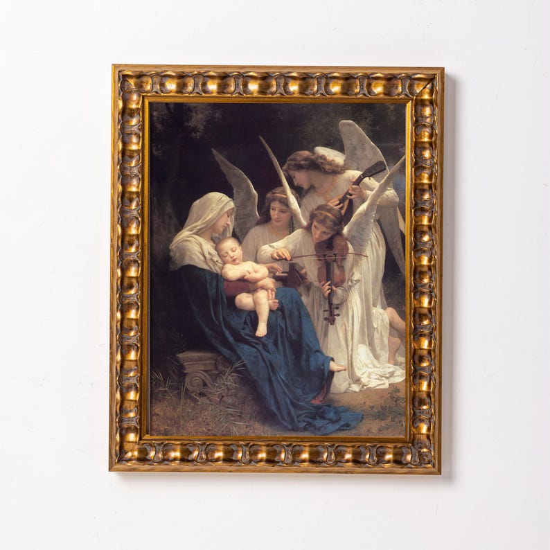 May include: A framed painting depicting a mother and child with two angels playing music. The mother is wearing a blue robe and the child is sleeping in her arms. The angels are wearing white robes and playing a violin and a harp.