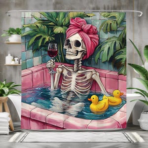 May include: A skeleton wearing a pink turban relaxes in a pink bathtub with a glass of red wine. Two yellow rubber duckies float in the water. Tropical plants and blue tiles are in the background.