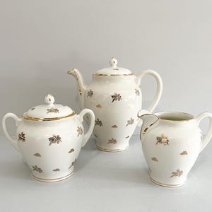 White and gold coffee service, in French porcelain, mid-20th century
