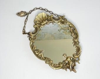Bronze wall mirror, decorated with cherubs and putti, 19th century
