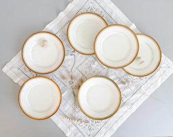 Flat plates in white and gold porcelain, Limoges, mid-20th century
