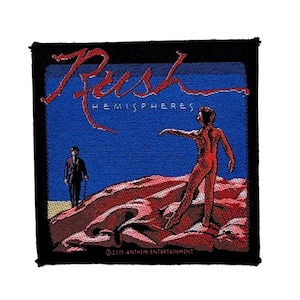 May include: A square embroidered patch featuring the Rush Hemispheres album artwork. The design shows a red figure standing on a rocky landscape against a blue sky, with a person in a suit nearby. The text reads Rush Hemispheres and 2015 Anthem Entertainment.