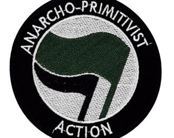 Naszywka z hasłem „Akcja Anarcho-Prymitywistów” 10 cm – Zielono-Czarna – Anprim – Anarcho-Prymitywizm – Ted Kaczynski – Earth First – Zielony Anarchizm