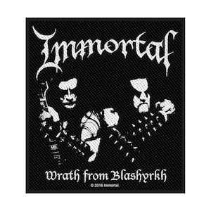 May include: Black square patch featuring the band name "Immortal" in white gothic lettering. Below, the text "Wrath from Blashyrkh" is displayed. The patch includes a graphic of three figures with white face paint and spiked accessories.