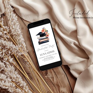 May include: A phone screen displaying a graduation party invitation with a black graduation cap, books, and flowers. The invitation reads "Luna Lewis Graduation Party" with the date and time of the event.