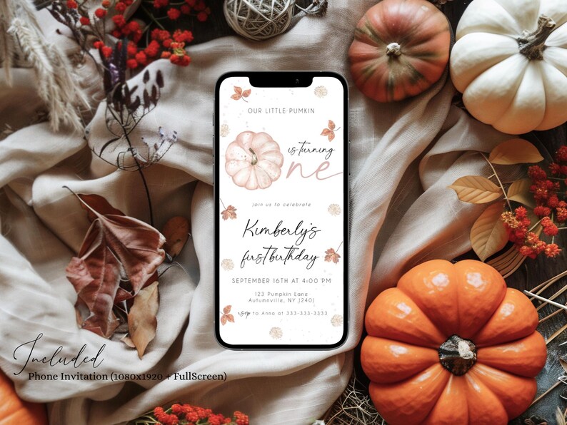 May include: A smartphone displays a fall-themed invitation with the text "Our Little Pumkin is turning one." The invitation includes the name "Kimberly" and the date of her first birthday. The image is surrounded by pumpkins, leaves, and fall foliage.