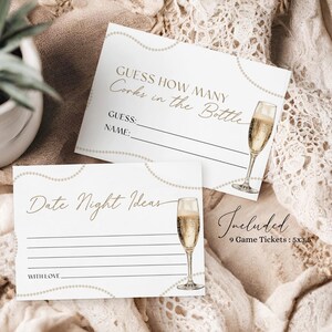 May include: Two white cards with gold accents and a champagne glass illustration. The top card says "Guess How Many Corks in the Bottle" with lines for a guess and name. The bottom card says "Date Night Ideas" with lines for writing. The text "Included 9 Game Tickets: 5x3.5" is at the bottom right corner.