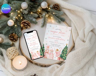 May include: A smartphone and invitation card with a watercolor design for a birthday party. The invitation reads "Our Little Sugar Plum is Turning One" with the name "Amanda" and the date "10". The design includes nutcrackers, ballerinas, and Christmas trees.
