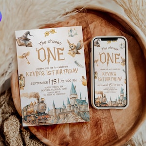 May include: A birthday invitation and a smartphone displaying the same design. The invitation features the text "The chosen ONE" and details for Kevin's 1st birthday, including a train, castle, and owl illustration. The phone shows the same design.