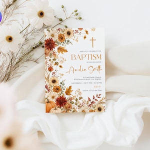 May include: A rectangular baptism invitation card featuring a floral border of autumn-colored flowers, leaves, and pumpkins. The text reads: Join us to celebrate the baptism of our daughter, Amelia Smith, St. Paul Parish Church, Oct 5th at 4pm.