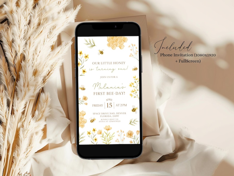 May include: A phone screen mockup showing a honeybee themed first birthday party invitation. The invitation features a honeycomb design, yellow flowers, and bees. The text on the invitation reads "Our little honey is turning one!" and "Join us for a Melania's First Bee Day!" The date and time of the party are listed as "Friday 15 at 2PM". The location is listed as "Space Drive 145, Denver, Florida, 11093".